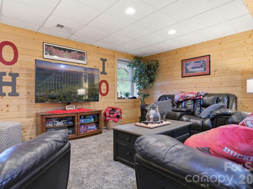 2235 Buck Mountain Road, Purlear, NC 28665.  MLS# CAR4422892, YatesRealty ID 49609. Lower Level Family Room