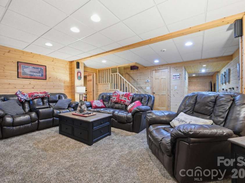 2235 Buck Mountain Road, Purlear, NC 28665.  MLS# CAR4422892, YatesRealty ID 49609. Lower Level Family Room