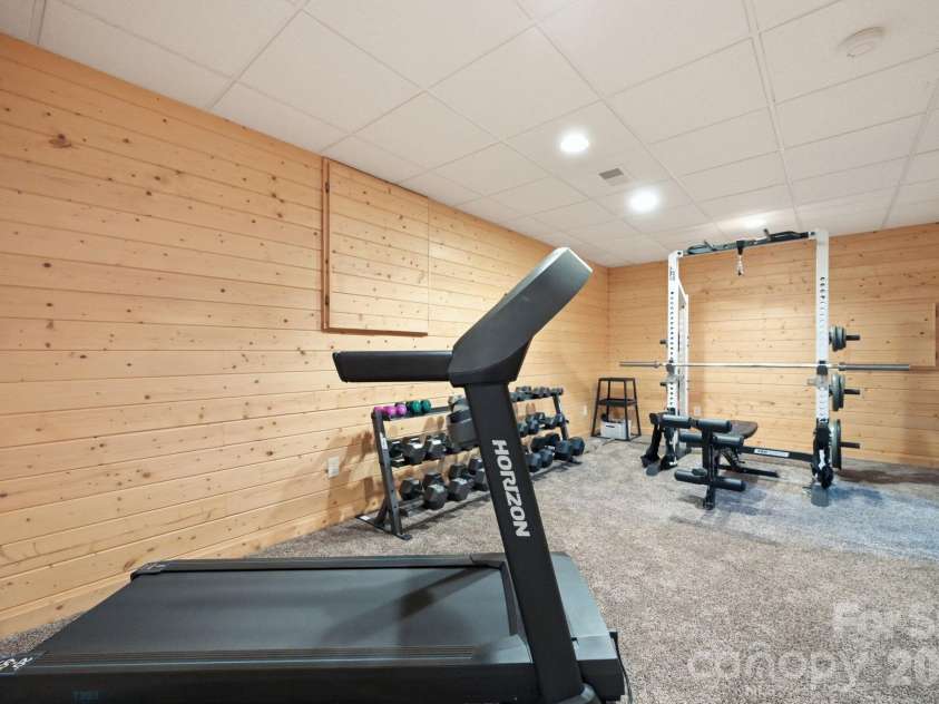 2235 Buck Mountain Road, Purlear, NC 28665.  MLS# CAR4422892, YatesRealty ID 49609. Lower Level Home Gym