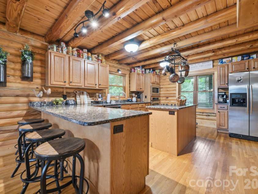 2235 Buck Mountain Road, Purlear, NC 28665.  MLS# CAR4422892, YatesRealty ID 49609. Spacious Kitchen with Breakfast Bar