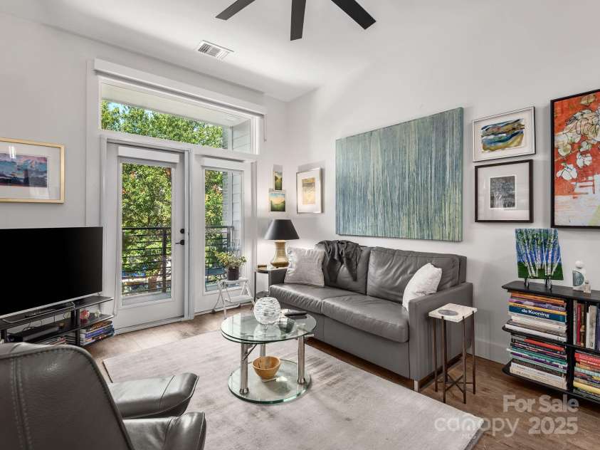 55 Market Street, Asheville, NC 28801.  MLS# CAR4285668, YatesRealty ID 4962. Living Room with balcony.