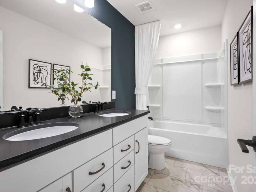 5220 Hatcher Creek Road, Charlotte, NC 28215.  MLS# CAR4228384, YatesRealty ID 4963. Photo Representation of guest bath up