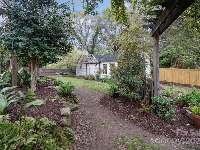 1313 York Road, Gastonia, NC 28052.  MLS# CAR4238759, YatesRealty ID 4964. Gardens: -Mature landscaping with crepe myrtles, camellias,azaleas, buttery bushes, maples, oaks, and magnolias-Enhanced with daylilies, crinums, hostas, ferns,gardenias, hydrangeas, and boxwoods