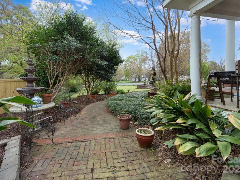 1313 York Road, Gastonia, NC 28052.  MLS# CAR4238759, YatesRealty ID 4964. Gardens: -Mature landscaping with crepe myrtles, camellias,azaleas, buttery bushes, maples, oaks, and magnolias-Enhanced with daylilies, crinums, hostas, ferns,gardenias, hydrangeas, and boxwoods