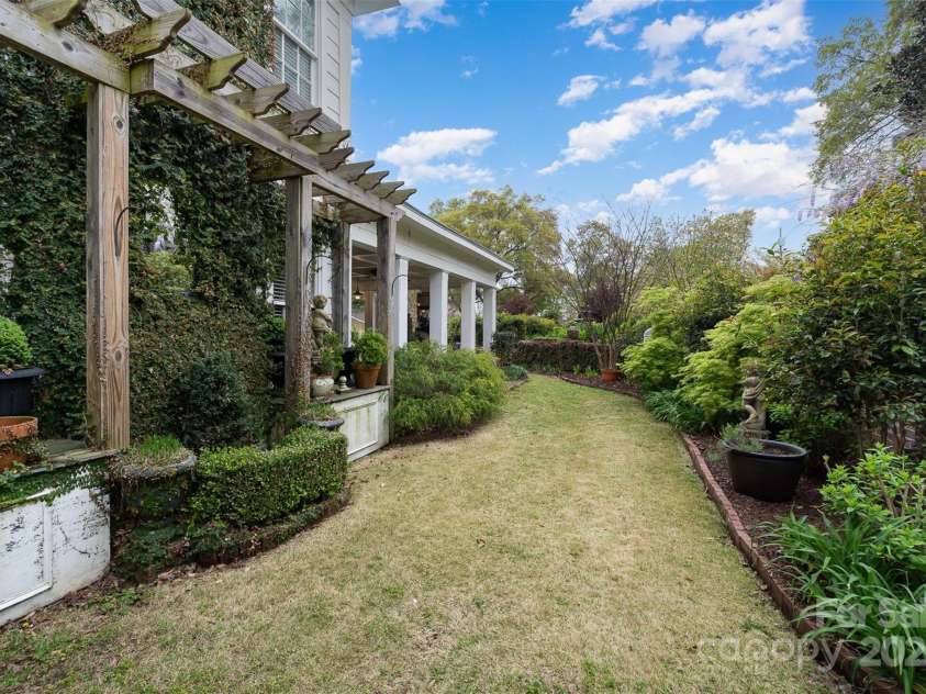 1313 York Road, Gastonia, NC 28052.  MLS# CAR4238759, YatesRealty ID 4964. Gardens: -Mature landscaping with crepe myrtles, camellias,azaleas, buttery bushes, maples, oaks, and magnolias-Enhanced with daylilies, crinums, hostas, ferns,gardenias, hydrangeas, and boxwoods