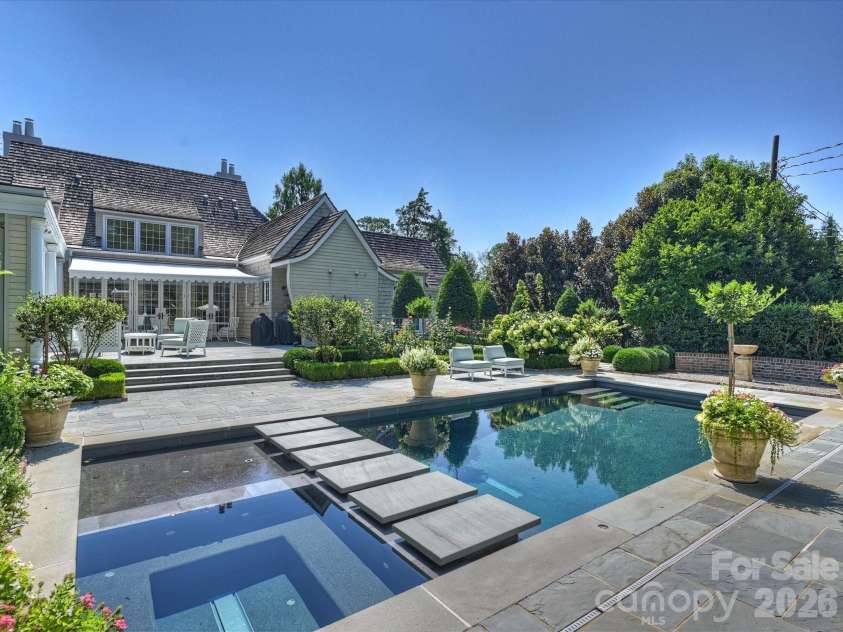 2414 Forest Drive, Charlotte, NC 28211.  MLS# CAR4420564, YatesRealty ID 49641. Resort-style backyard with saltwater pool and spa