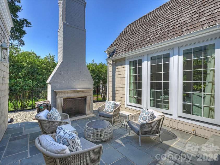 2414 Forest Drive, Charlotte, NC 28211.  MLS# CAR4420564, YatesRealty ID 49641. Side yard courtyard has wood-burning fireplace