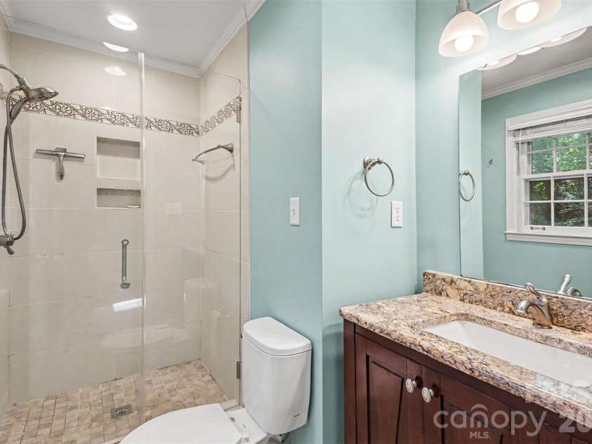 113 Brookshire Avenue, Kannapolis, NC 28083.  MLS# CAR4416740, YatesRealty ID 49665. The Updated Primary Full Sized bath features a tiled walk-in shower and Vanity