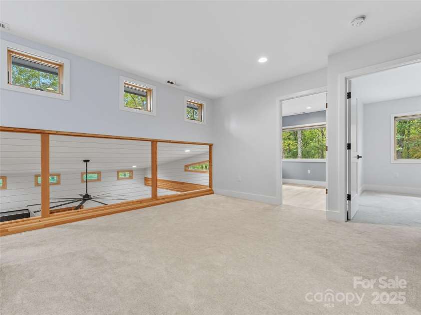 584 Springbrook Lane, Brevard, NC 28712.  MLS# CAR4308876, YatesRealty ID 4967. Upstairs loft flex space