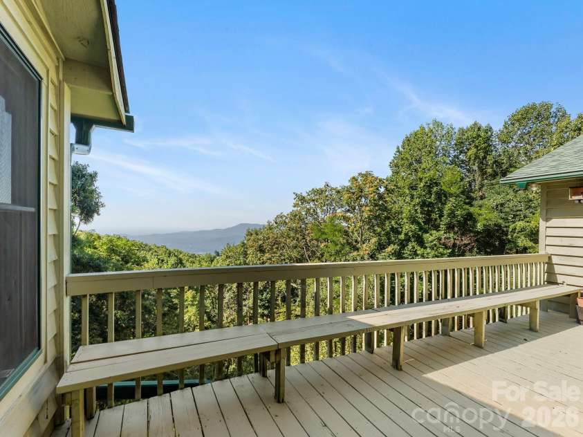 977 Morning Ride Drive, Columbus, NC 28722.  MLS# CAR4419017, YatesRealty ID 49673. Deck between All-Seasons room and main-level garage