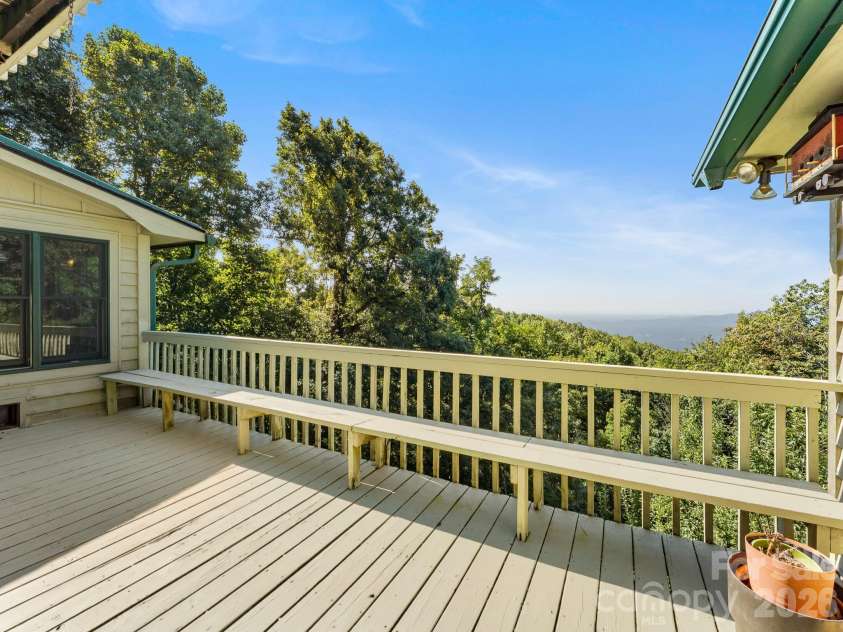 977 Morning Ride Drive, Columbus, NC 28722.  MLS# CAR4419017, YatesRealty ID 49673. Deck between All-Seasons room and main-level garage