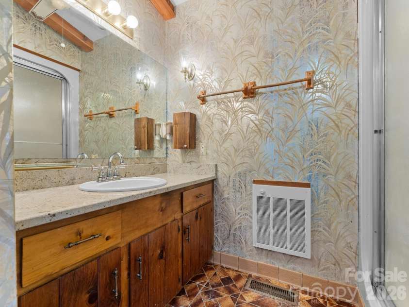 977 Morning Ride Drive, Columbus, NC 28722.  MLS# CAR4419017, YatesRealty ID 49673. Primary bathroom vanity