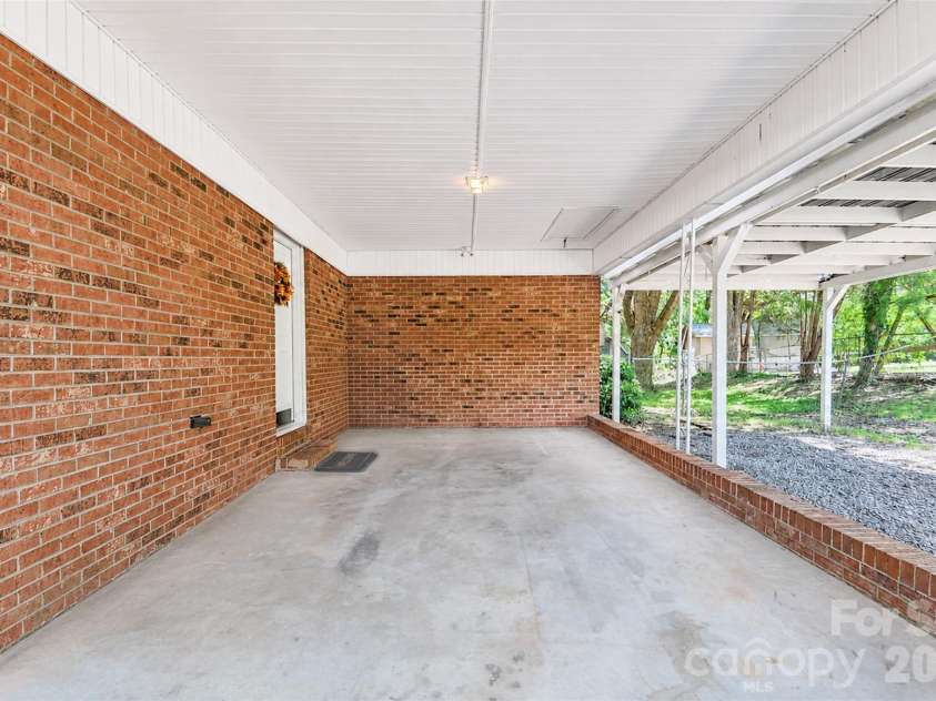 2281 Munsen Road, Concord, NC 28025.  MLS# CAR4422449, YatesRealty ID 49679. Attached Carport