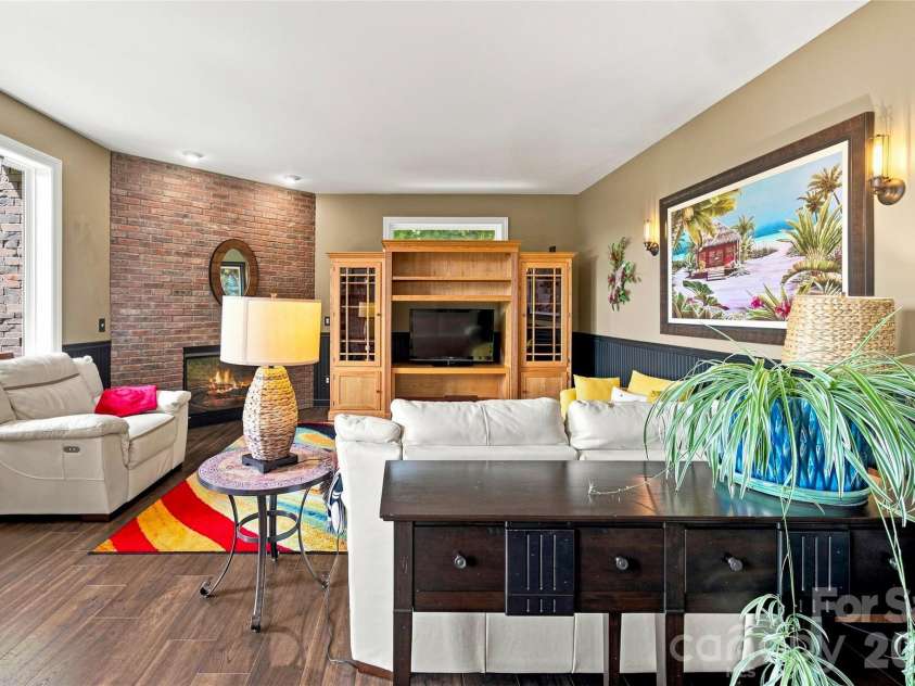 99 Distant View Drive, Asheville, NC 28803.  MLS# CAR4421771, YatesRealty ID 49685. Lower-Level Family Room with Fireplace