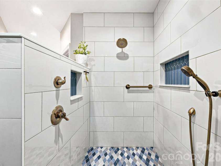 99 Distant View Drive, Asheville, NC 28803.  MLS# CAR4421771, YatesRealty ID 49685. Newly Tiled Walk-In Shower with Bench