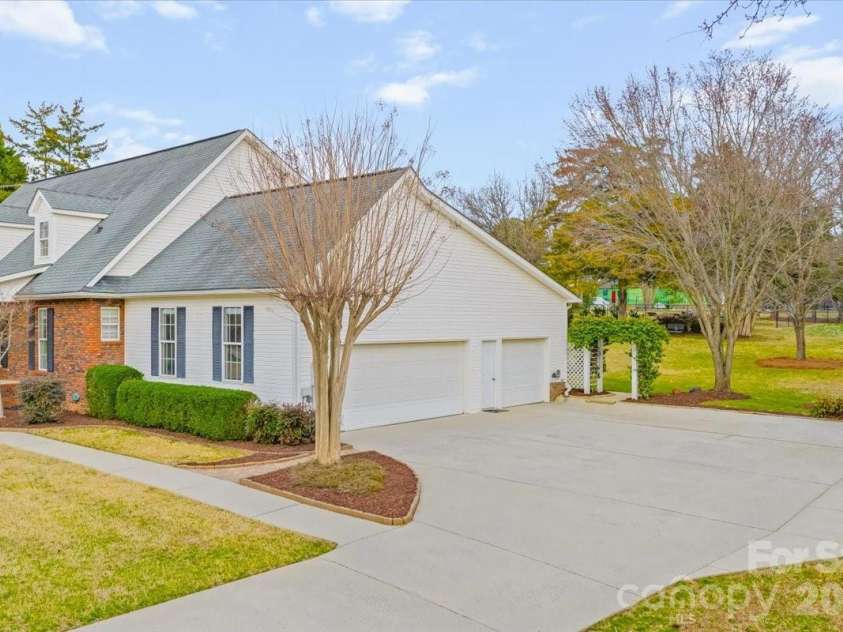 16601 Jefferson Place, Fort Mill, SC 29708.  MLS# CAR4351321, YatesRealty ID 4972. Side load 2 car garage with extra storage space
