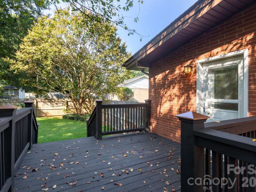 1526 Briarfield Drive, Charlotte, NC 28205.  MLS# CAR4422287, YatesRealty ID 49726. Overlooking a private, tree-lined backyard.