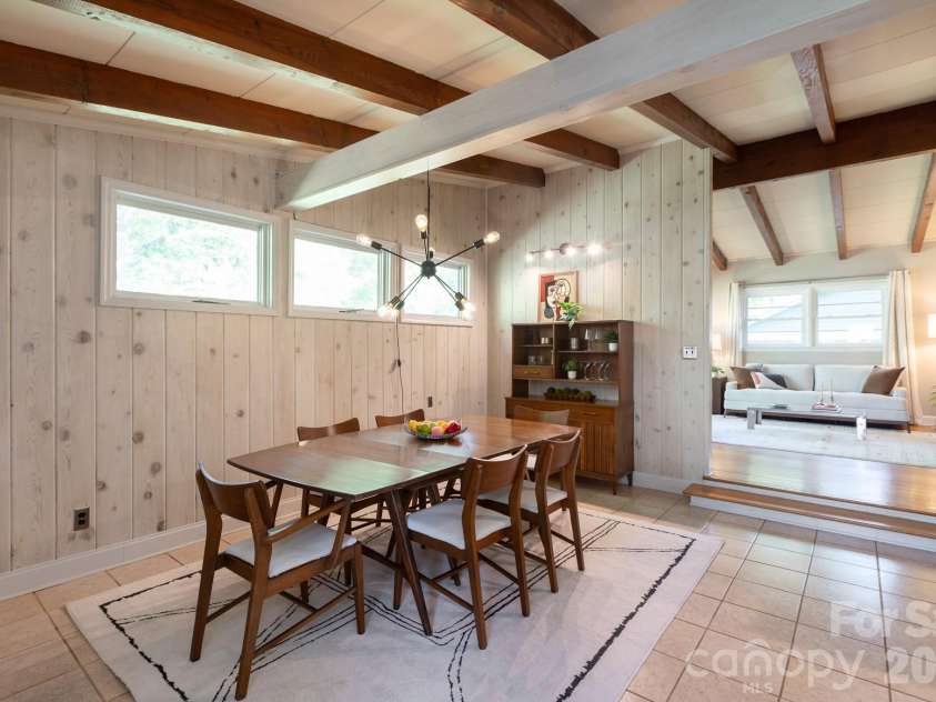 1526 Briarfield Drive, Charlotte, NC 28205.  MLS# CAR4422287, YatesRealty ID 49726. Refreshed wood paneling and a statement chandelier.