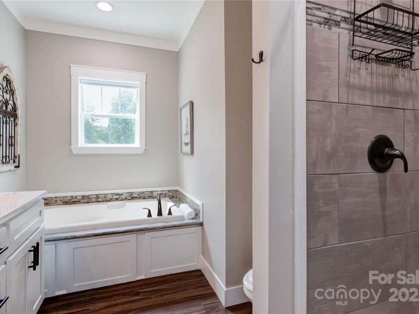 115 Cascade Ridge Road, Fairview, NC 28730.  MLS# CAR4222933, YatesRealty ID 4973. Master Bathroom with soaking tub and shower