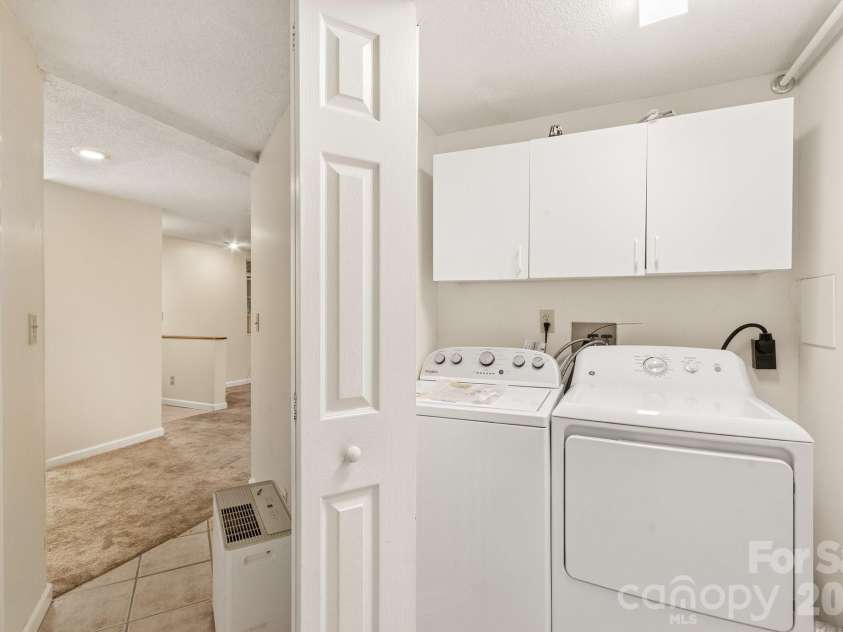 529 Alta Vista Drive, Hendersonville, NC 28791.  MLS# CAR4419901, YatesRealty ID 49743. Laundry in hallway