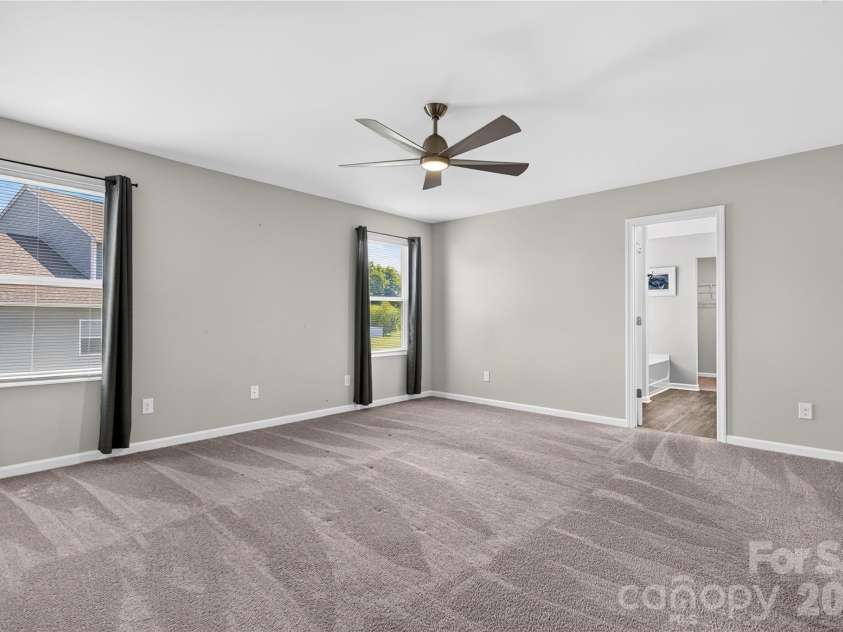 167 Sutters Mill Drive, Troutman, NC 28166.  MLS# CAR4422610, YatesRealty ID 49746. Primary Bedroom