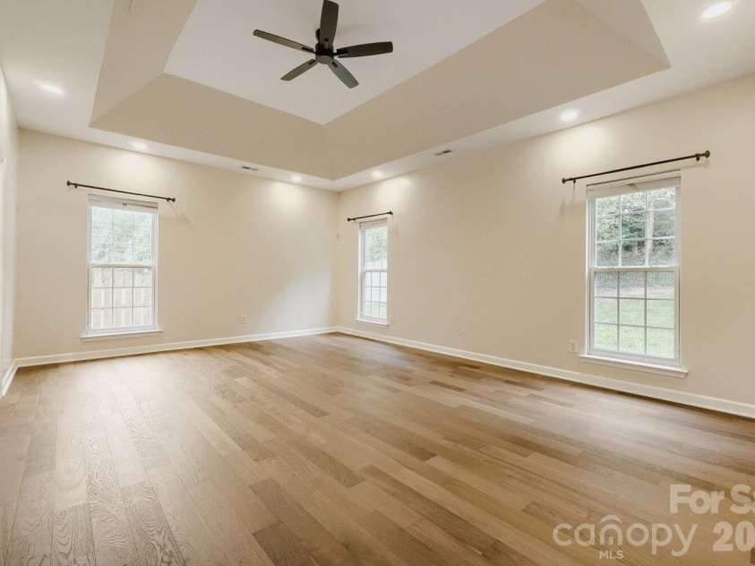 12015 Hampton Place Drive, Charlotte, NC 28269.  MLS# CAR4422407, YatesRealty ID 49747. Large Primary Suite - Trey Ceiling & Ceiling Fan