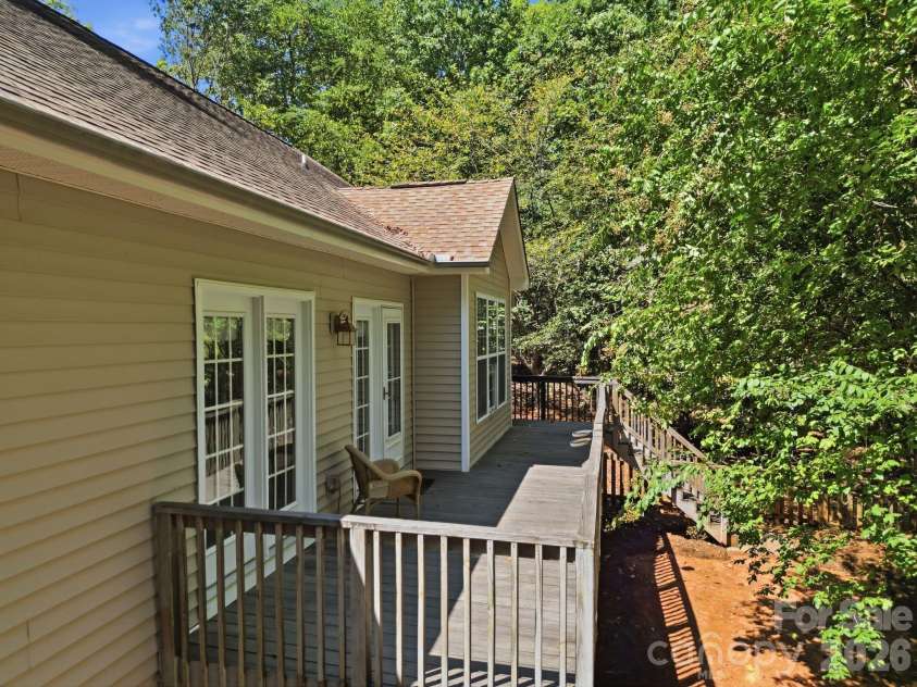 14724 Beatties Ford Road, Huntersville, NC 28078.  MLS# CAR4422428, YatesRealty ID 49748. Back deck with 3 access doors