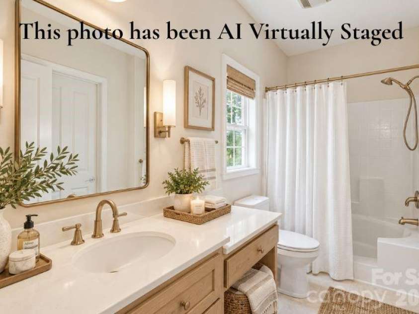 14724 Beatties Ford Road, Huntersville, NC 28078.  MLS# CAR4422428, YatesRealty ID 49748. Virtually Staged Spacious primary bathroom featuring an elegant soaking tub