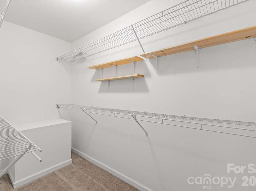 910 Beverly Drive, Rock Hill, SC 29730.  MLS# CAR4421788, YatesRealty ID 49769. A dedicated walk-in closet in the primary suite designed to keep your wardrobe fully organized with generous hanging space and easy accessibility.