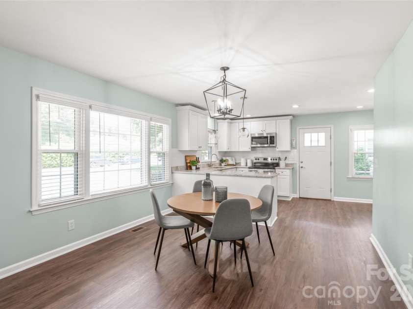 910 Beverly Drive, Rock Hill, SC 29730.  MLS# CAR4421788, YatesRealty ID 49769. Dining area features custom designer light fixture, seamlessly blending the open living space.
