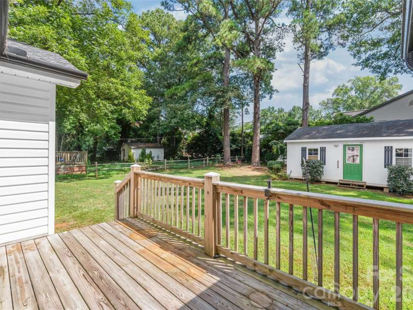 910 Beverly Drive, Rock Hill, SC 29730.  MLS# CAR4421788, YatesRealty ID 49769. Step directly from your primary bedroom onto a private back deck, creating a seamless connection between your personal retreat and outdoor relaxation.