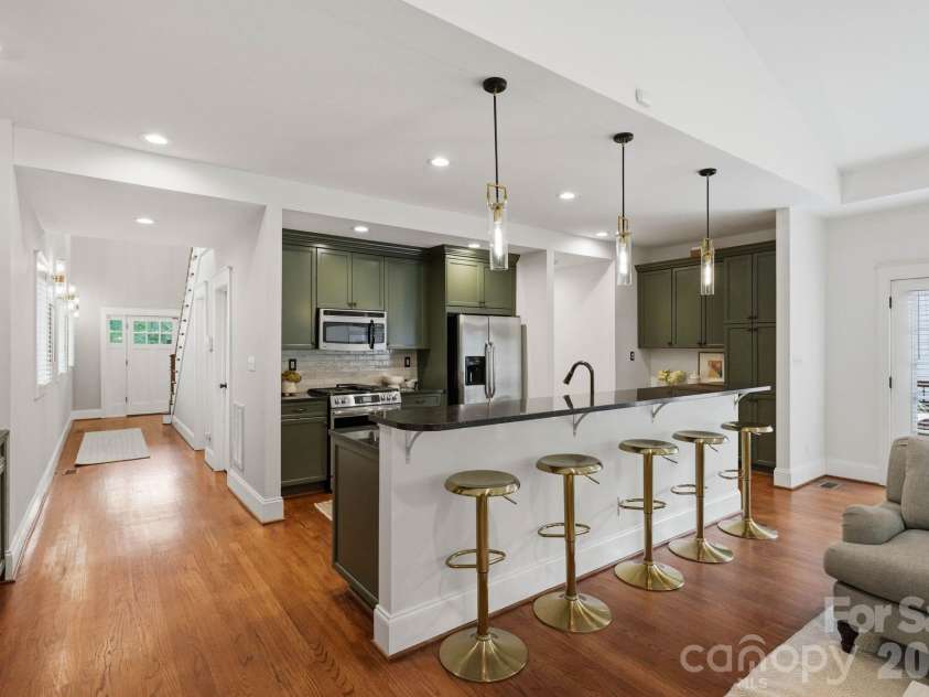 1815 DeArmon Drive, Charlotte, NC 28205.  MLS# CAR4421209, YatesRealty ID 49773. Bar seating and breakfast nook!