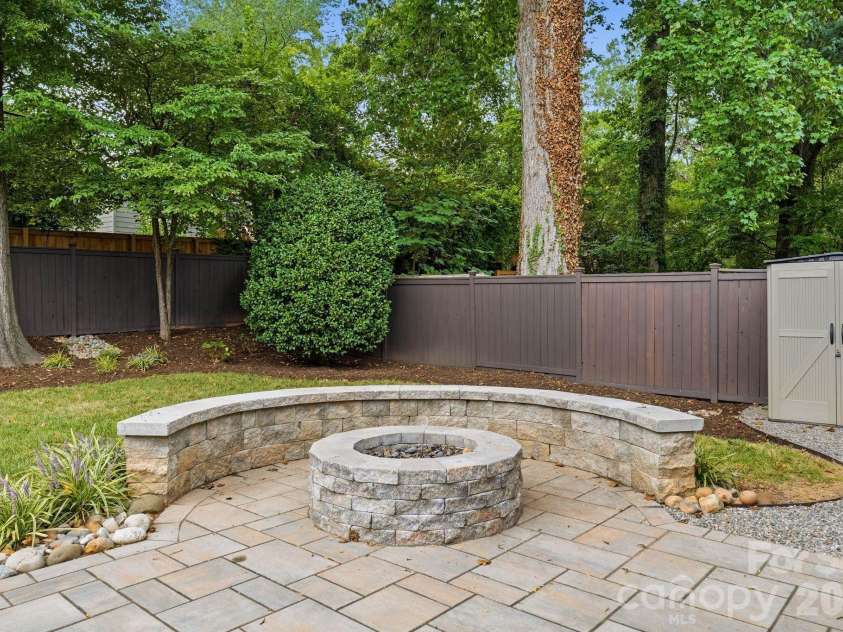 1815 DeArmon Drive, Charlotte, NC 28205.  MLS# CAR4421209, YatesRealty ID 49773. Custom built stone fireplace with built-in seating