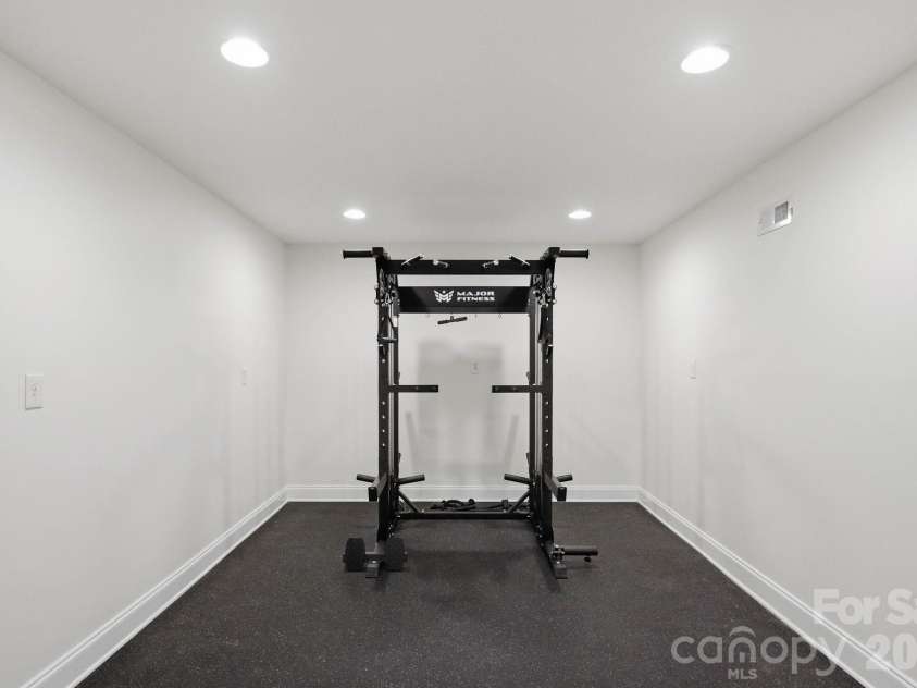 1815 DeArmon Drive, Charlotte, NC 28205.  MLS# CAR4421209, YatesRealty ID 49773. Gym space in basement