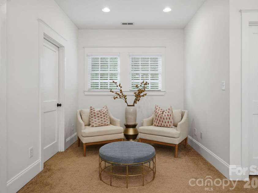 1815 DeArmon Drive, Charlotte, NC 28205.  MLS# CAR4421209, YatesRealty ID 49773. Reading nook in primary bedroom