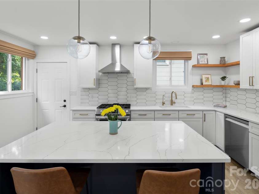 33 Maywood Road, Asheville, NC 28804.  MLS# CAR4420601, YatesRealty ID 49789. Ceramic backsplash compliments gorgeous countertops