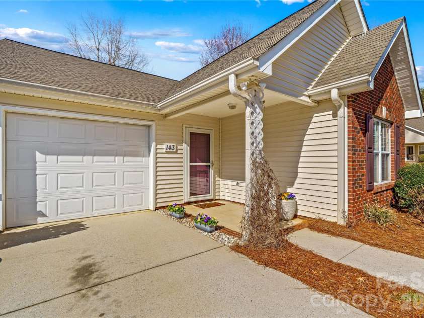 143 Ashwood Lane, Mooresville, NC 28117.  MLS# CAR4349646, YatesRealty ID 4979. 1-car garage and ample parking driveway