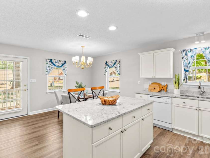 143 Ashwood Lane, Mooresville, NC 28117.  MLS# CAR4349646, YatesRealty ID 4979. Dining area off of Kitchen