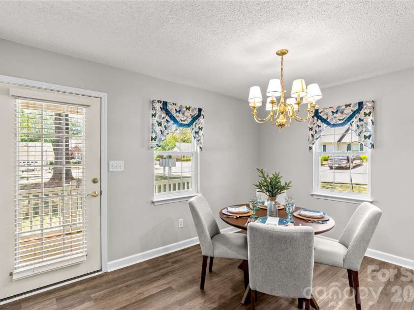 143 Ashwood Lane, Mooresville, NC 28117.  MLS# CAR4349646, YatesRealty ID 4979. Dining area with nice sitting porch just outside