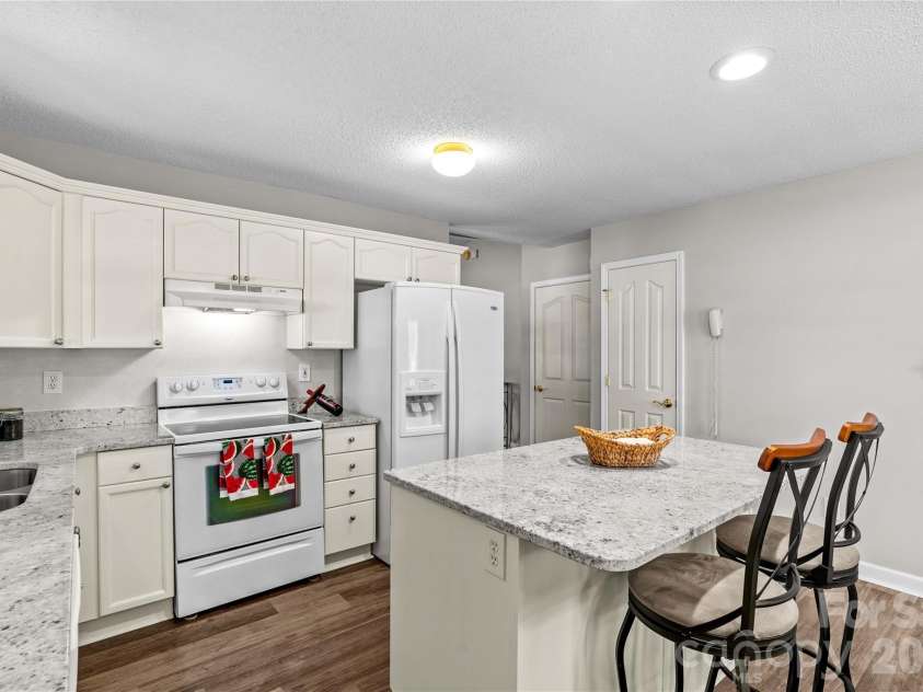 143 Ashwood Lane, Mooresville, NC 28117.  MLS# CAR4349646, YatesRealty ID 4979. Kitchen with Island, Dishwasher, Range, Oven and Refrigerator