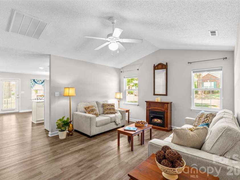143 Ashwood Lane, Mooresville, NC 28117.  MLS# CAR4349646, YatesRealty ID 4979. Living room off of kitchen and dining area