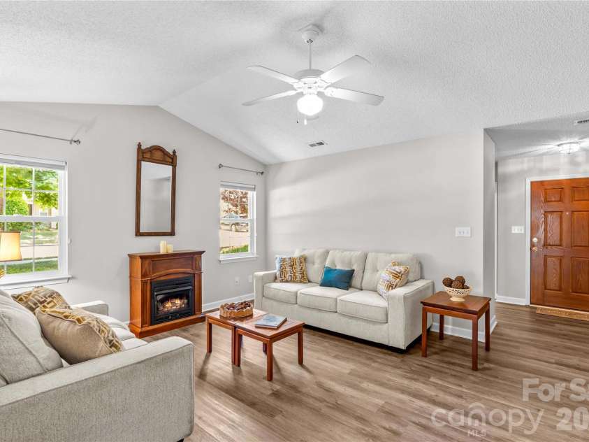143 Ashwood Lane, Mooresville, NC 28117.  MLS# CAR4349646, YatesRealty ID 4979. Nice gas fireplace that heats the whole home when necessary
