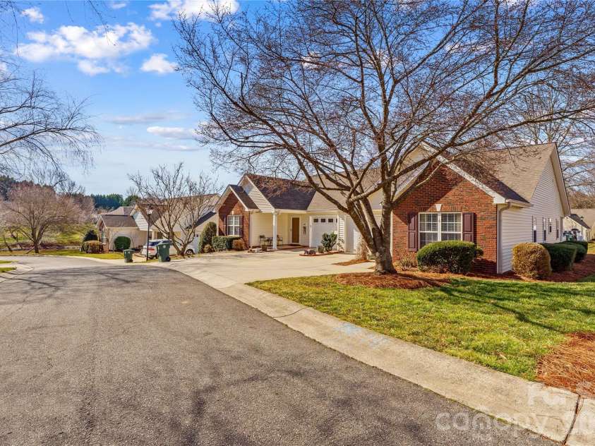 143 Ashwood Lane, Mooresville, NC 28117.  MLS# CAR4349646, YatesRealty ID 4979. Street View - Pond at end of street and mailbox to the right of the yard 