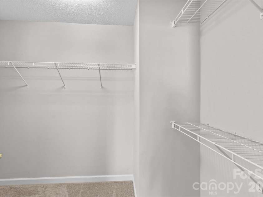 143 Ashwood Lane, Mooresville, NC 28117.  MLS# CAR4349646, YatesRealty ID 4979. Walk in Closet in Primary Bedroom