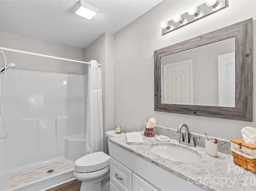 143 Ashwood Lane, Mooresville, NC 28117.  MLS# CAR4349646, YatesRealty ID 4979. Walk in shower in primary