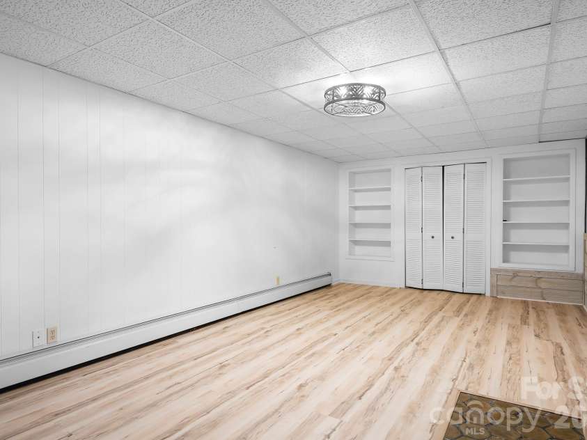 316 Hudson Drive, Harrisburg, NC 28075.  MLS# CAR4420210, YatesRealty ID 49798. Basement level room could be potential bedroom or flex space.