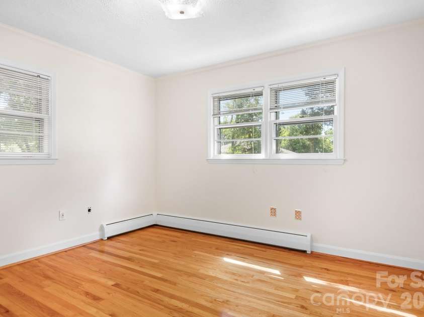 316 Hudson Drive, Harrisburg, NC 28075.  MLS# CAR4420210, YatesRealty ID 49798. Corner guest bedroom