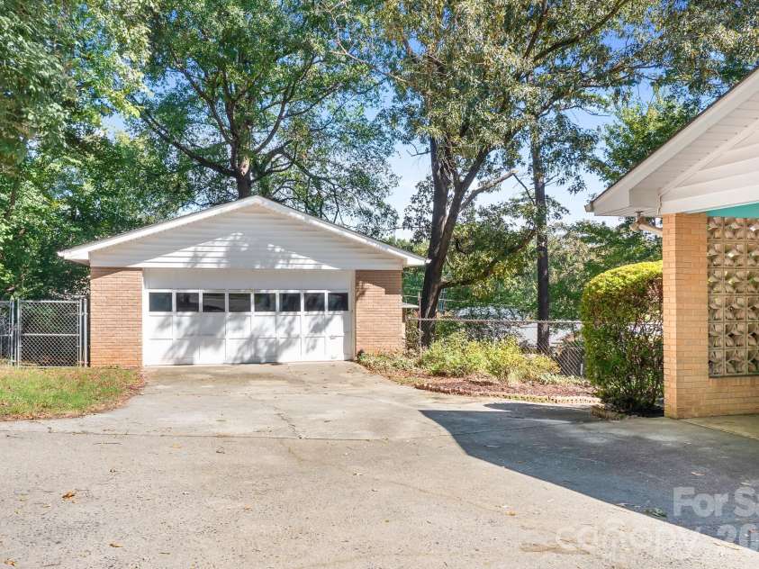 316 Hudson Drive, Harrisburg, NC 28075.  MLS# CAR4420210, YatesRealty ID 49798. Detached garage for more parking and your favorite projects. Convenient door controller is built into the wall in the kitchen.