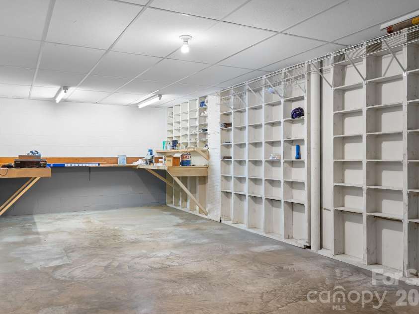 316 Hudson Drive, Harrisburg, NC 28075.  MLS# CAR4420210, YatesRealty ID 49798. Unfinished basement space for hobbies, workshop, or tons of storage.