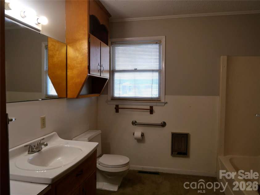 220 Russell Street, Troy, NC 27371.  MLS# CAR4357867, YatesRealty ID 4980. Full bath #1. 